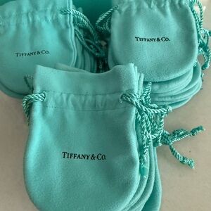 Tiffany & Co small drawstring pouches.